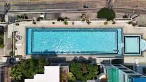 an overhead view of a large swimming pool at Grosvenor House - Olympic Pool - Pattaya in Pattaya South