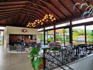a lobby of a house with a living room at Resort QSB - Um novo padrão de conforto e lazer no coração da cidade in Pirenópolis