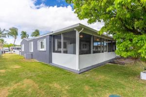 a modern house with a large yard at Centrally located Family-business Home in Homestead