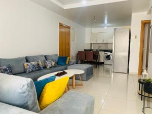 a living room with a couch and a table at Atlas Sunset Lodge in Agadir