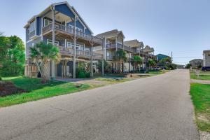 a street in front of a house with palm trees at Surf City House about 400 Ft Walk to Beach with Decks! in Surf City