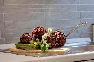 two pineapples on a cutting board on a sink at AnticaFirenze in Florence +113 photos