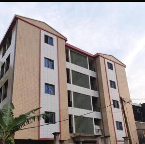 a largeartment building with two floors at At home Douala Cameroun in Douala