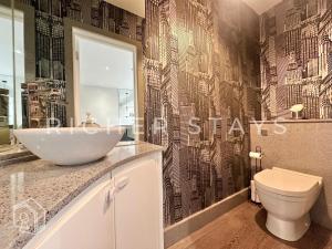 a bathroom with a sink and a toilet at Premium 3BR House, French Doors and Private Garden in Borehamwood +17 photos