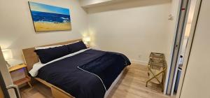 a bedroom with a large bed in a room at Casa del Rio - Peaceful River Guest Suite -Forests -Mountains -Hiking in Chilliwack