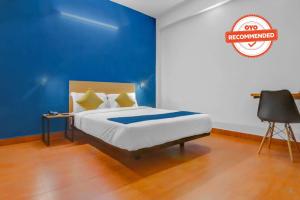 Postel nebo postele na pokoji v ubytování Hotel O Harma Residency Near Jazz Cinemas Luxe
