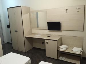 TV a/nebo společenská místnost v ubytování Herges Hotel