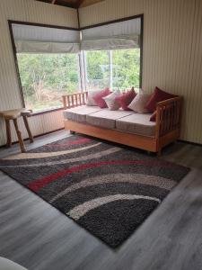 Ένα ή περισσότερα κρεβάτια σε δωμάτιο στο Cabañas Costabudy