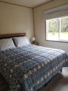 Ένα ή περισσότερα κρεβάτια σε δωμάτιο στο Cabañas Costabudy +3 φωτογραφίες