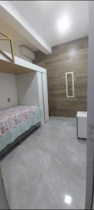 a bedroom with a bed in a room at Casa a 2 minutos da praia! in Rio de Janeiro