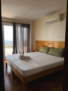 Postel nebo postele na pokoji v ubytování Seaview Mansion Dalaguete Deluxe Apartment 10