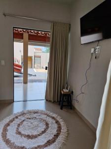 a living room with a rug on the floor at Espaço Run in Bálsamo