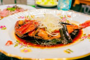 a plate of food with noodles on a table at StellaMarina~海の星　ATAMI in Shimo-taga