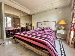 a bedroom with two beds and two lamps at Villa de Maître 6 Chambres avec Piscine et Jacuzzi - FR-1-768-119 in Roquebrune-sur-Argens +25 photos