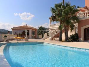 a swimming pool in front of a house at Villa de Maître 6 Chambres avec Piscine et Jacuzzi - FR-1-768-119 in Roquebrune-sur-Argens