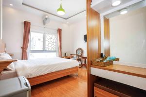 Postel nebo postele na pokoji v ubytování Thanh Anh 2 Hotel - Gần Chợ Đêm Đà Lạt
