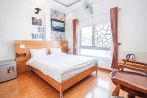 Postel nebo postele na pokoji v ubytování Thanh Anh 2 Hotel - Gần Chợ Đêm Đà Lạt