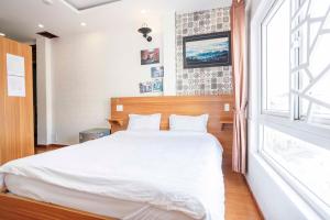 Postel nebo postele na pokoji v ubytování Thanh Anh 2 Hotel - Gần Chợ Đêm Đà Lạt