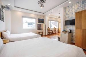 Postel nebo postele na pokoji v ubytování Thanh Anh 2 Hotel - Gần Chợ Đêm Đà Lạt