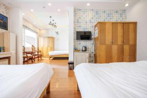 Postel nebo postele na pokoji v ubytování Thanh Anh 2 Hotel - Gần Chợ Đêm Đà Lạt