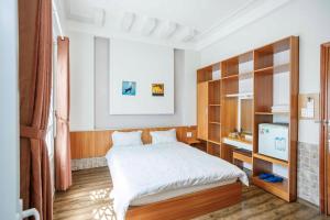 Postel nebo postele na pokoji v ubytování Thanh Anh 2 Hotel - Gần Chợ Đêm Đà Lạt