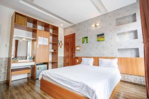 Postel nebo postele na pokoji v ubytování Thanh Anh 2 Hotel - Gần Chợ Đêm Đà Lạt