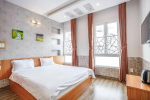 Postel nebo postele na pokoji v ubytování Thanh Anh 2 Hotel - Gần Chợ Đêm Đà Lạt