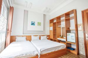 Postel nebo postele na pokoji v ubytování Thanh Anh 2 Hotel - Gần Chợ Đêm Đà Lạt