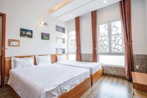 Postel nebo postele na pokoji v ubytování Thanh Anh 2 Hotel - Gần Chợ Đêm Đà Lạt