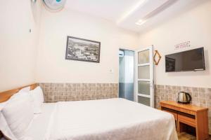 Postel nebo postele na pokoji v ubytování Thanh Anh 2 Hotel - Gần Chợ Đêm Đà Lạt