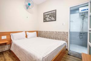 Postel nebo postele na pokoji v ubytování Thanh Anh 2 Hotel - Gần Chợ Đêm Đà Lạt