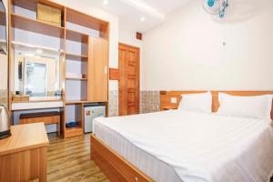 Postel nebo postele na pokoji v ubytování Thanh Anh 2 Hotel - Gần Chợ Đêm Đà Lạt