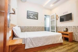 Postel nebo postele na pokoji v ubytování Thanh Anh 2 Hotel - Gần Chợ Đêm Đà Lạt