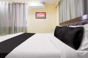 Postel nebo postele na pokoji v ubytování Hotel O Bluebird Inn