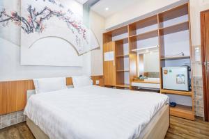 Postel nebo postele na pokoji v ubytování Thanh Anh 2 Hotel - Gần Chợ Đêm Đà Lạt