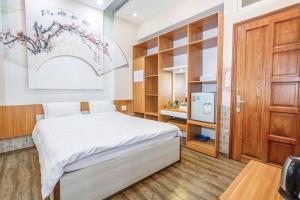 Postel nebo postele na pokoji v ubytování Thanh Anh 2 Hotel - Gần Chợ Đêm Đà Lạt