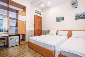 Postel nebo postele na pokoji v ubytování Thanh Anh 2 Hotel - Gần Chợ Đêm Đà Lạt
