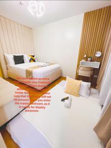 Ένα ή περισσότερα κρεβάτια σε δωμάτιο στο SEAWIND CONDOMINIUM 2Bedrooms near Davao Airport, SM Lanang, Sasa Wharf, Dusit Thani, Waterfront Insular Hotel, Azuela Cove, Acacia Hotel, Abreeza Mall, Lots 4 Less, Puregold & a lot more