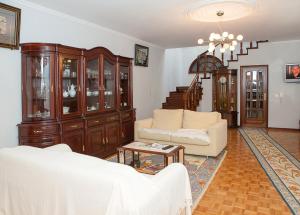 a living room with a couch and a table at Guest House A&z in Espinho