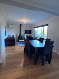 a living room with a dining room table and chairs at Buchan Motel in Buchan