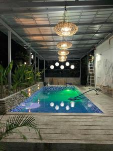 a swimming pool in a room with a ceiling at Don Ignacio's Place in Cabancalan