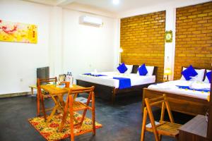 TV a/nebo společenská místnost v ubytování Sigiriya Dream Inn
