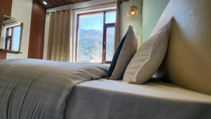 Ліжко або ліжка в номері Hotel Mahadev