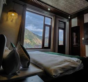 Ліжко або ліжка в номері Hotel Mahadev