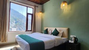 Ліжко або ліжка в номері Hotel Mahadev
