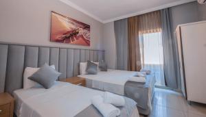 Postel nebo postele na pokoji v ubytování Infinity Hotel