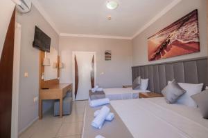 Postel nebo postele na pokoji v ubytování Infinity Hotel