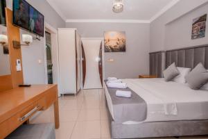 Postel nebo postele na pokoji v ubytování Infinity Hotel