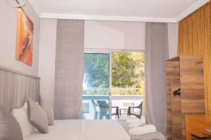 Postel nebo postele na pokoji v ubytování Infinity Hotel