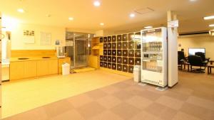 a room with a store with a refrigerator in it at New Gloria Oita Hotel in Oita
